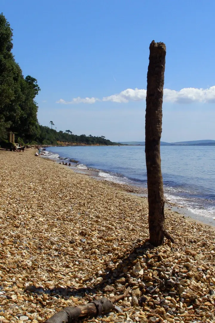 Simple sundial made of sticks at Stanswood Bay, with the shadow of the big stick hitting the little stick at noon