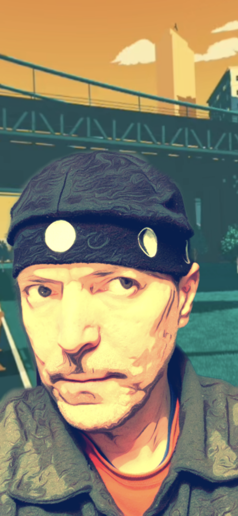 Man wearing the Moon Hat in beret style. The hat is loosely bunched and then pulled forward to give an intense ring of Moon phase images that are carried above the ear.